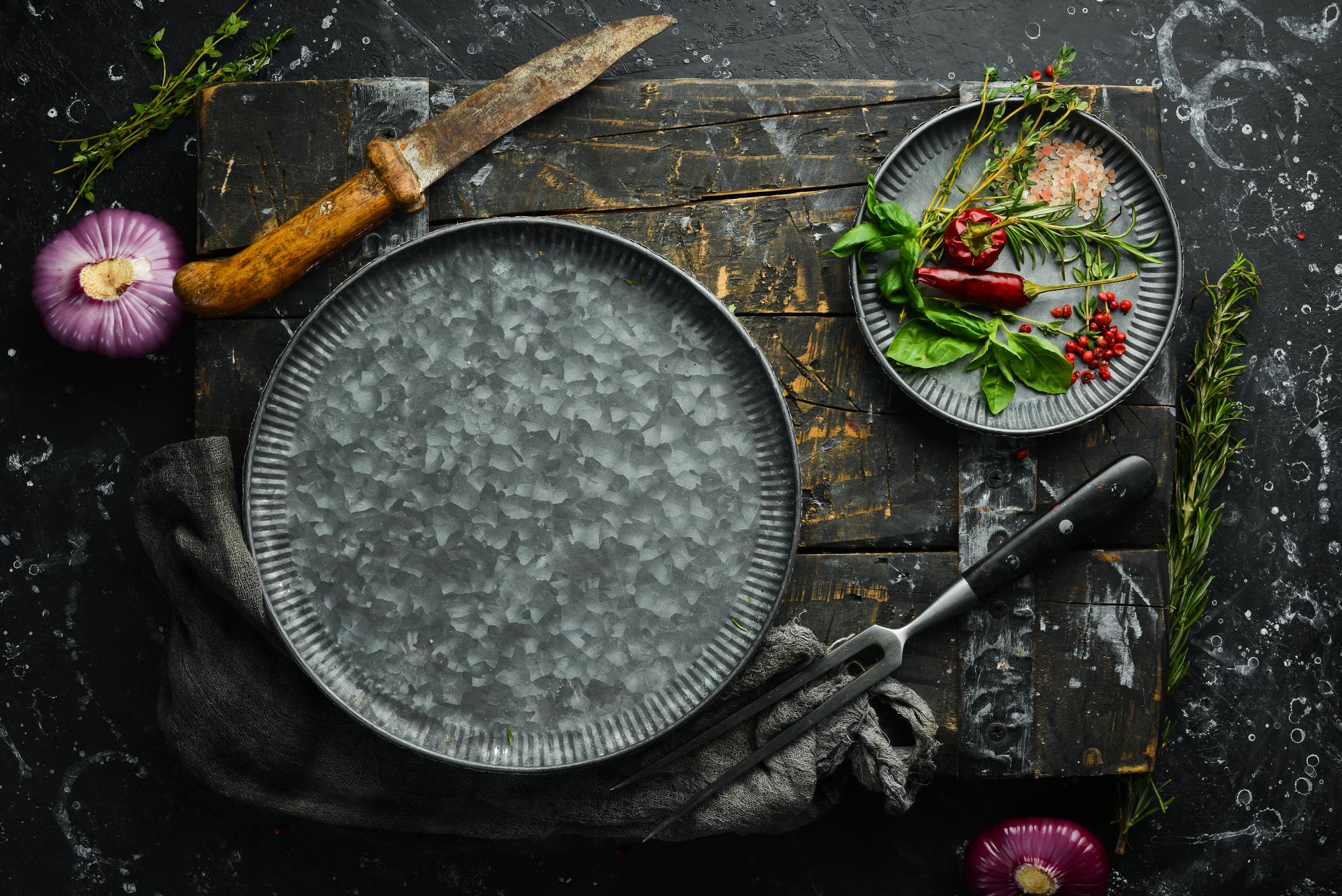 Assorted plated dishes on a slate board