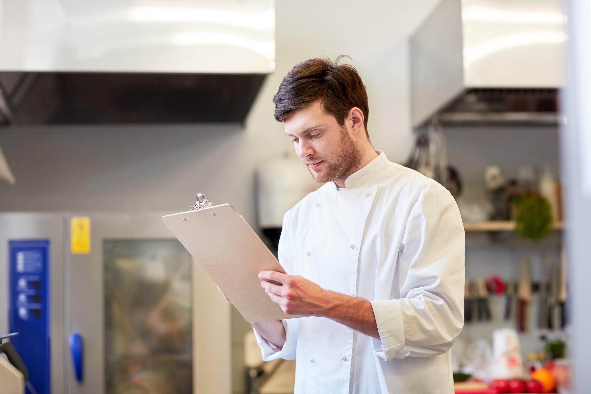 Quality manager reviewing checklist